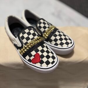 Vans Black and White Checkered Slip-Ons with Red Heart and Gold Studs